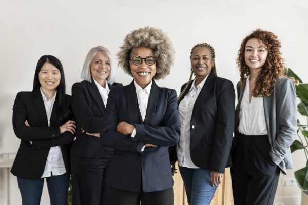 group multiracial business women meeting with arms crossed - business concept -